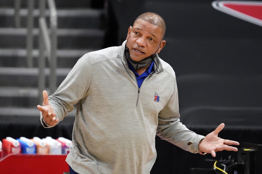 Doc Rivers questions an official during a game