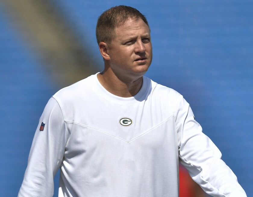 FILE - Green Bay Packers quarterbacks/passing game coordinator Luke Getsy walks on the field before a preseason NFL football game against the Buffalo Bills in Orchard Park, N.Y., Aug. 28, 2021. On Thursday, Feb. 10, 2022, the Chicago Bears introduced Getsy as their new offensive coordinator along with new defensive coordinator Alan Williams and special teams coordinator Richard Hightower. (AP Photo/Adrian Kraus, File)