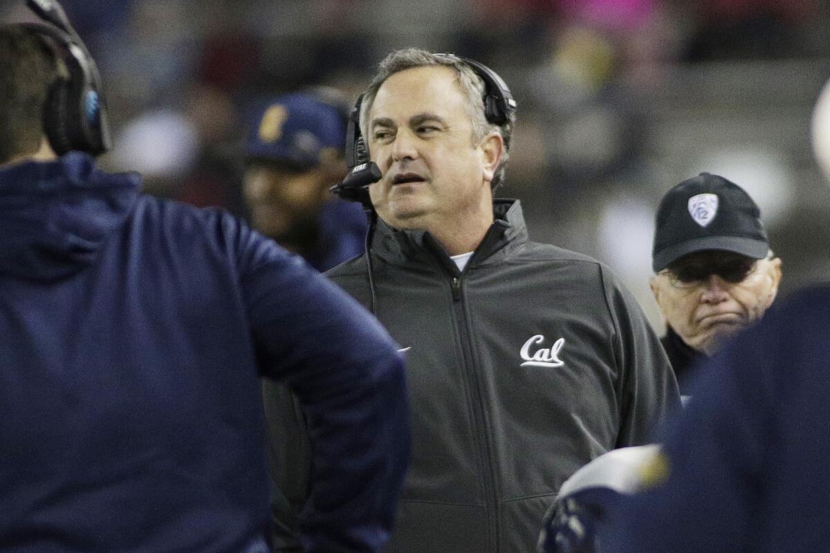 California Coach Sonny Dykes, center, walks along the sideline during the first half of a game against Washington State on Nov. 12, 2016.