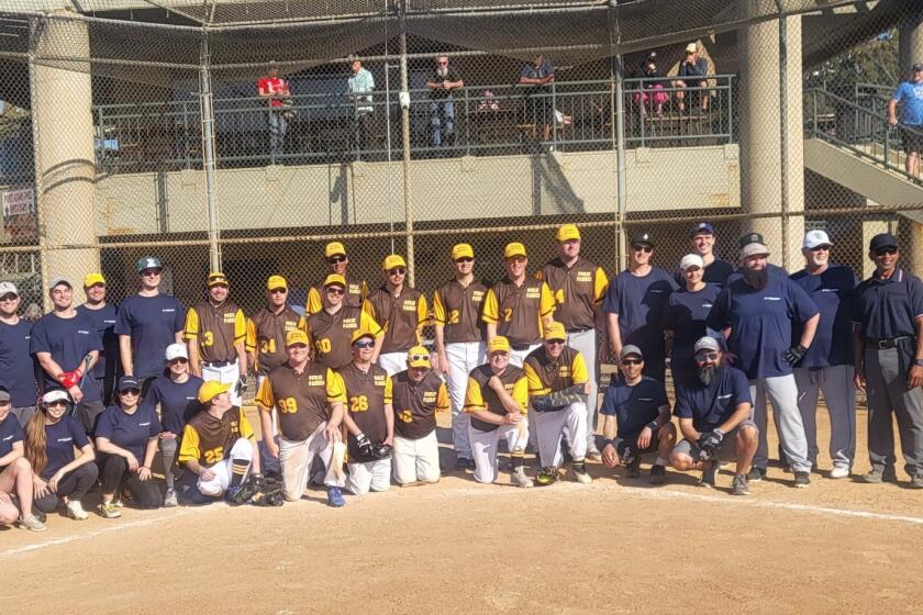 The Poway Padres Special Olympics softball team had fun playing against General Atomics staff April 21.