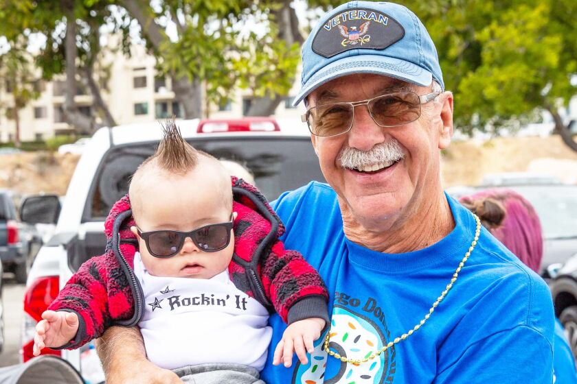 John Scalone holding his grandson, Brody.