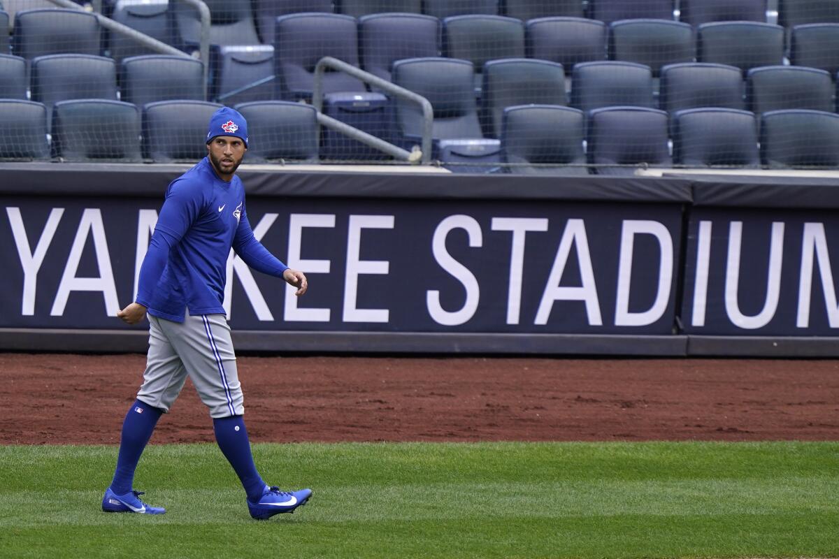 Toronto Blue Jays center fielder George Springer (4) walks on the field during a team workout, Wednesday, March 31, 2021, at Yankee Stadium in New York. The Blue Jays face the New York Yankees on opening day Thursday in New York. (AP Photo/Kathy Willens)