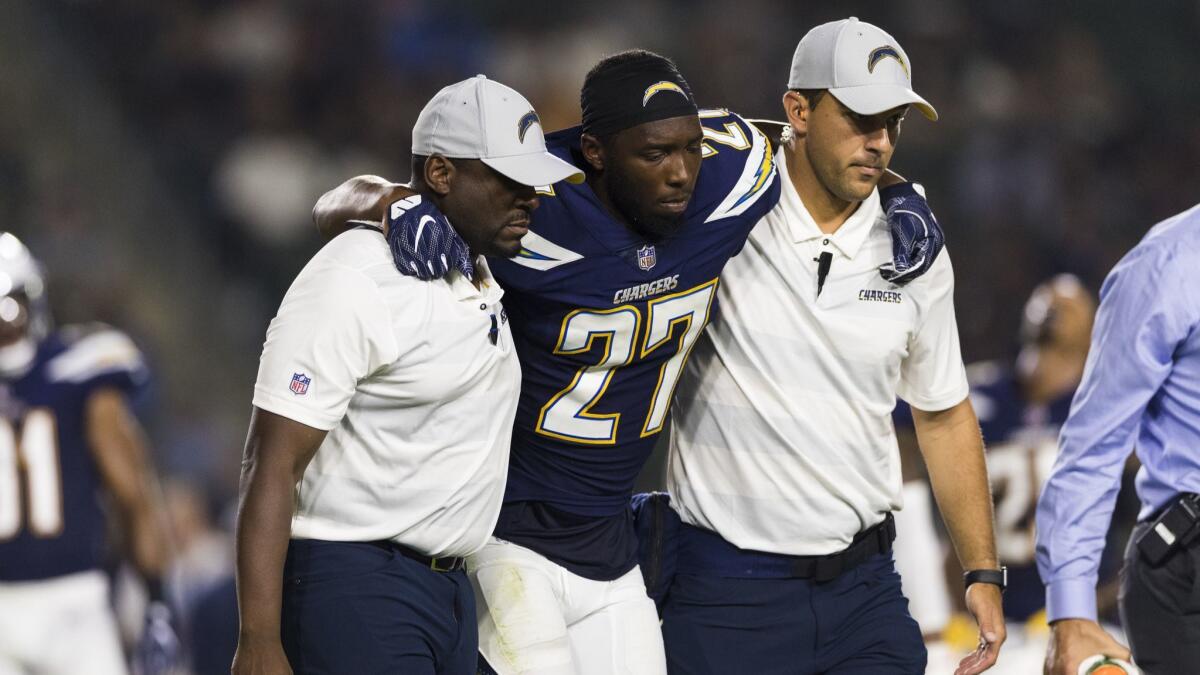 Chargers defensive back Jaylen Watkins is helped off the field after suffering a torn anterior cruciate ligament against the Seattle Seahawks on Aug. 18.