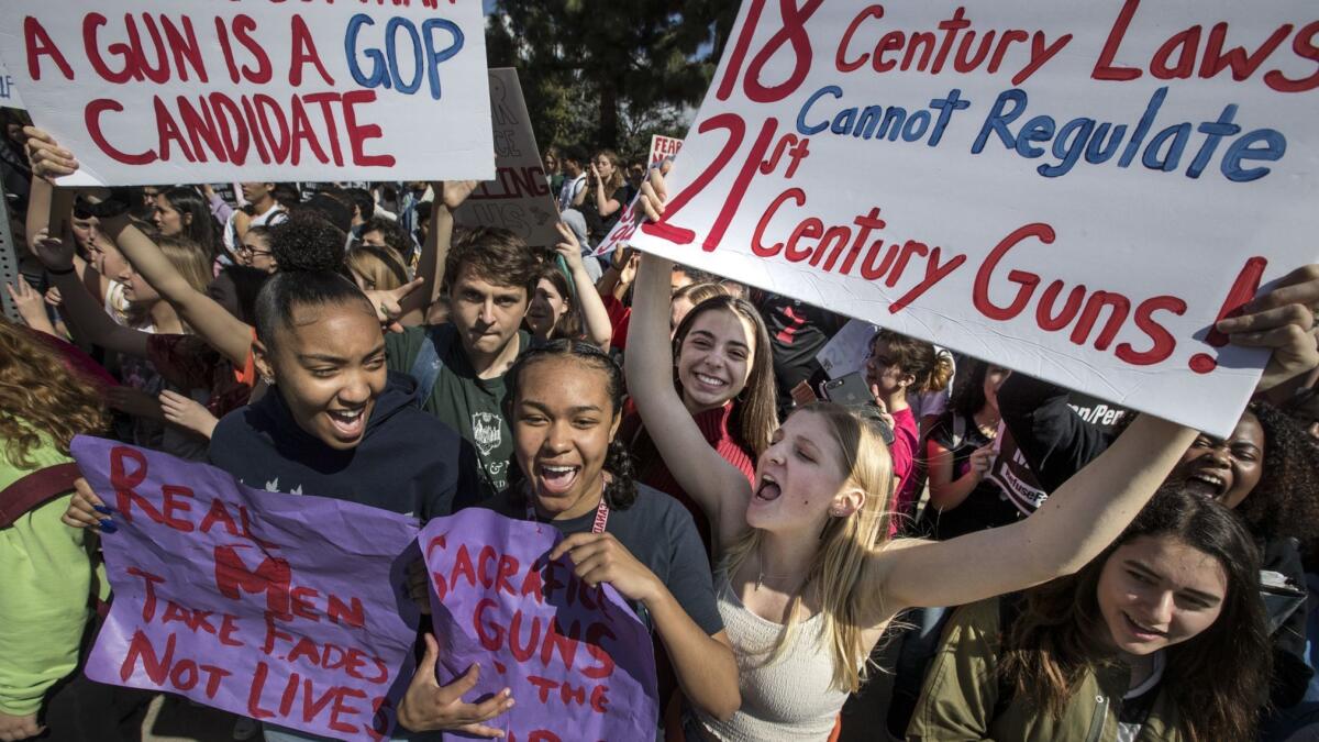 Students at Los Angeles Center for Enriched Studies shout slogans during a walkout in support of Parkland shooting victims and tougher gun control.