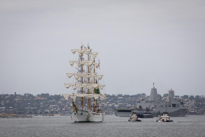 San Diego, California - May 16: Dozens of people cheer as a 261 person crew arrives on a tall ship called Cuauhtemoc on Thursday, May 16, 2024 in San Diego, California. The training ship is part of the Mexican Navy Secretariat and has been used for 41 years - traveling to more than 228 ports in 73 countries. (Ana Ramirez / The San Diego Union-Tribune)