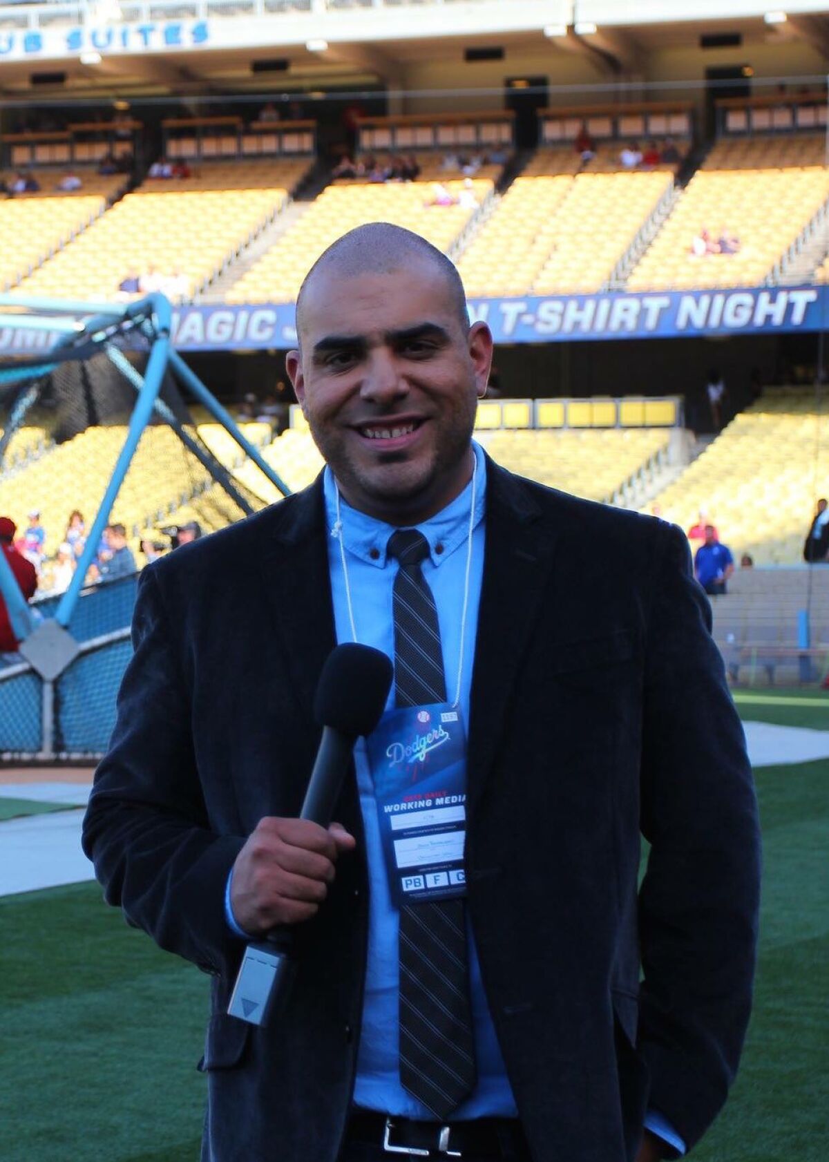 Jason Barquero covers a Dodgers game as a freelance reporter in 2013.