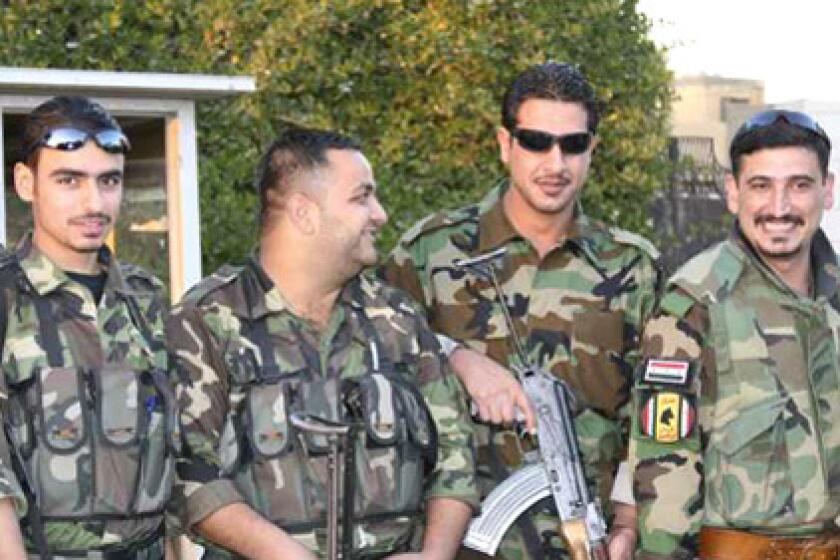 Abu Abed, far right, is shown with members of his paramilitary group in this 2007 photo.