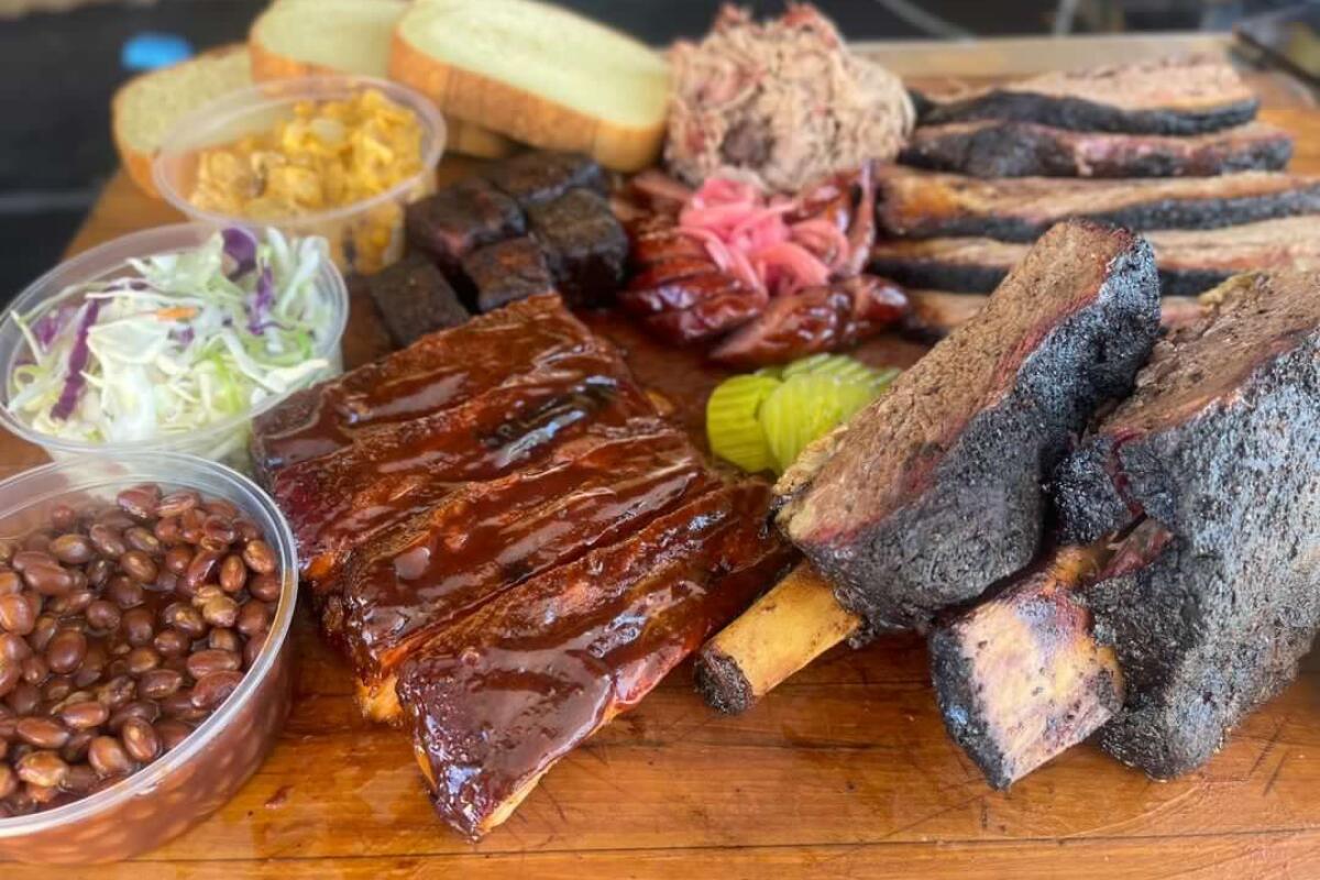A spread of barbecued meats and sides from Beatdown BBQ 