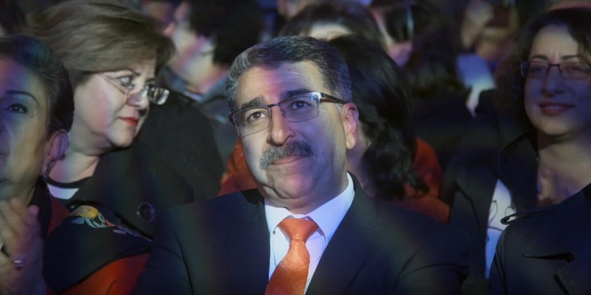 The mayor of Ramallah, Musa Hadid, seated in audience in the documentary "Mayor."
