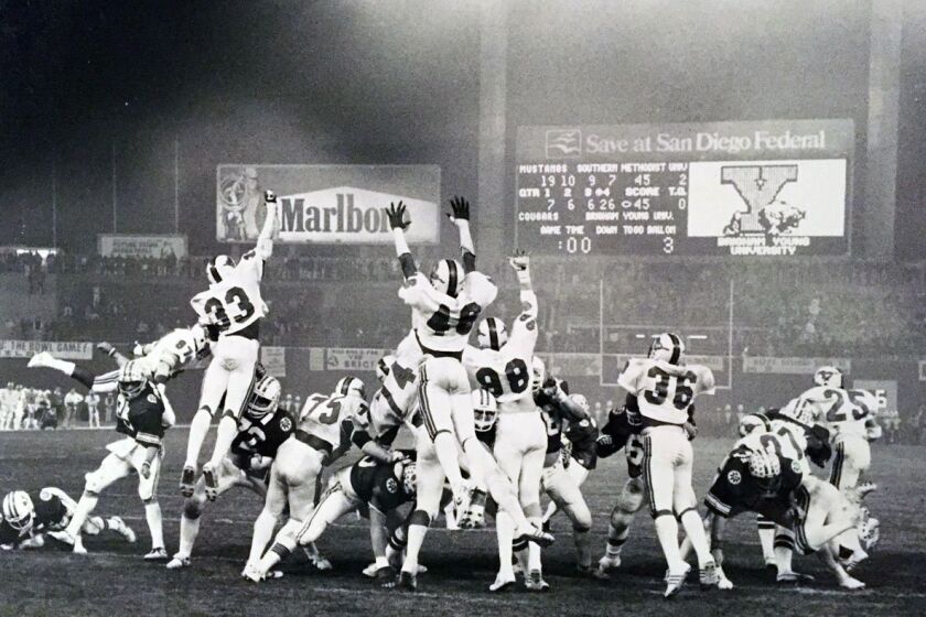 BYU kicks the extra point for its 46-45 victory over SMU in the 1980 Holiday Bowl.