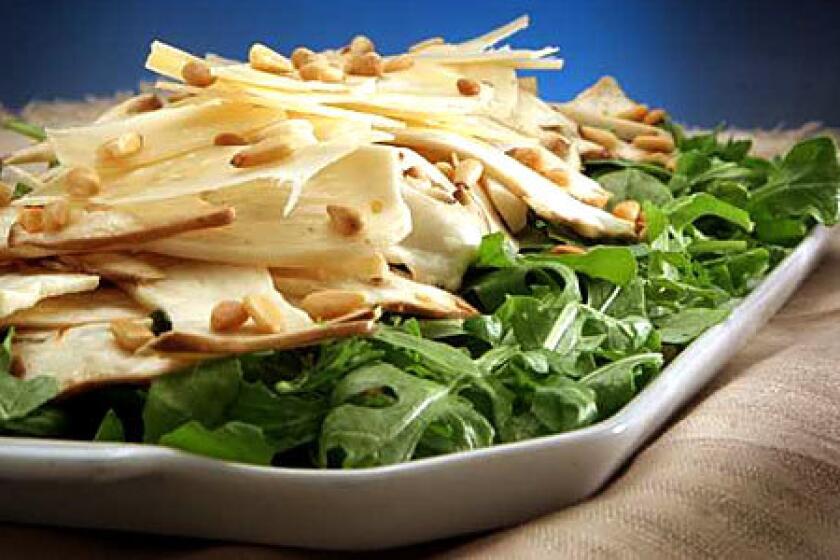 IN THE RAW: Thin-sliced king trumpets add texture and a briny tone to an arugula and Parmigiano salad.