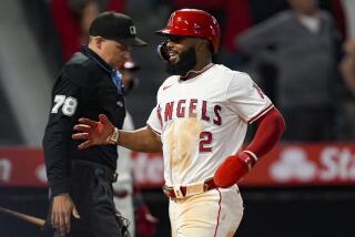 Los Angeles Angels' Luis Rengifo celebrates scoring on a double by Taylor Ward against the New York Yankees during the eighth inning of a baseball game Tuesday, May 28, 2024, in Anaheim, Calif. (AP Photo/Ryan Sun)