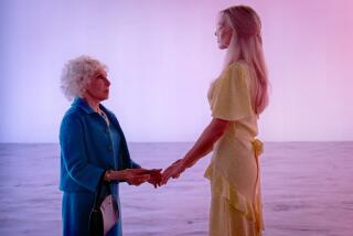 RHEA PERLMAN as Ruth Handler and MARGOT ROBBIE as Barbie in Warner Bros. Pictures' "BARBIE."