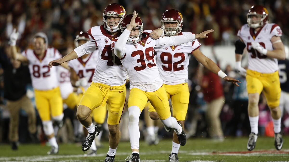 USC kicker Matt Boermeester, 39, celebrates with holder Wyatt Schmidt after making a game-winning 46-yard field goal as time expired to beat Penn State 52-49 in the Rose Bowl Game.