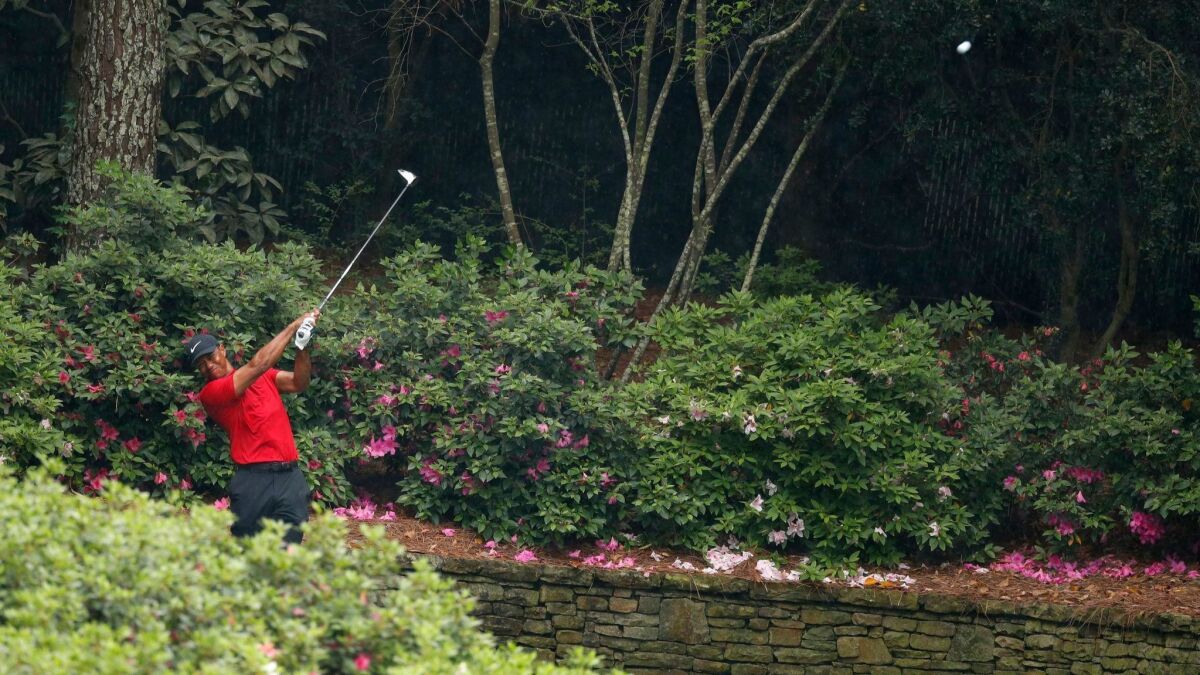 Tiger Woods tees off on the 13th hole during the final round of the Masters on Sunday.
