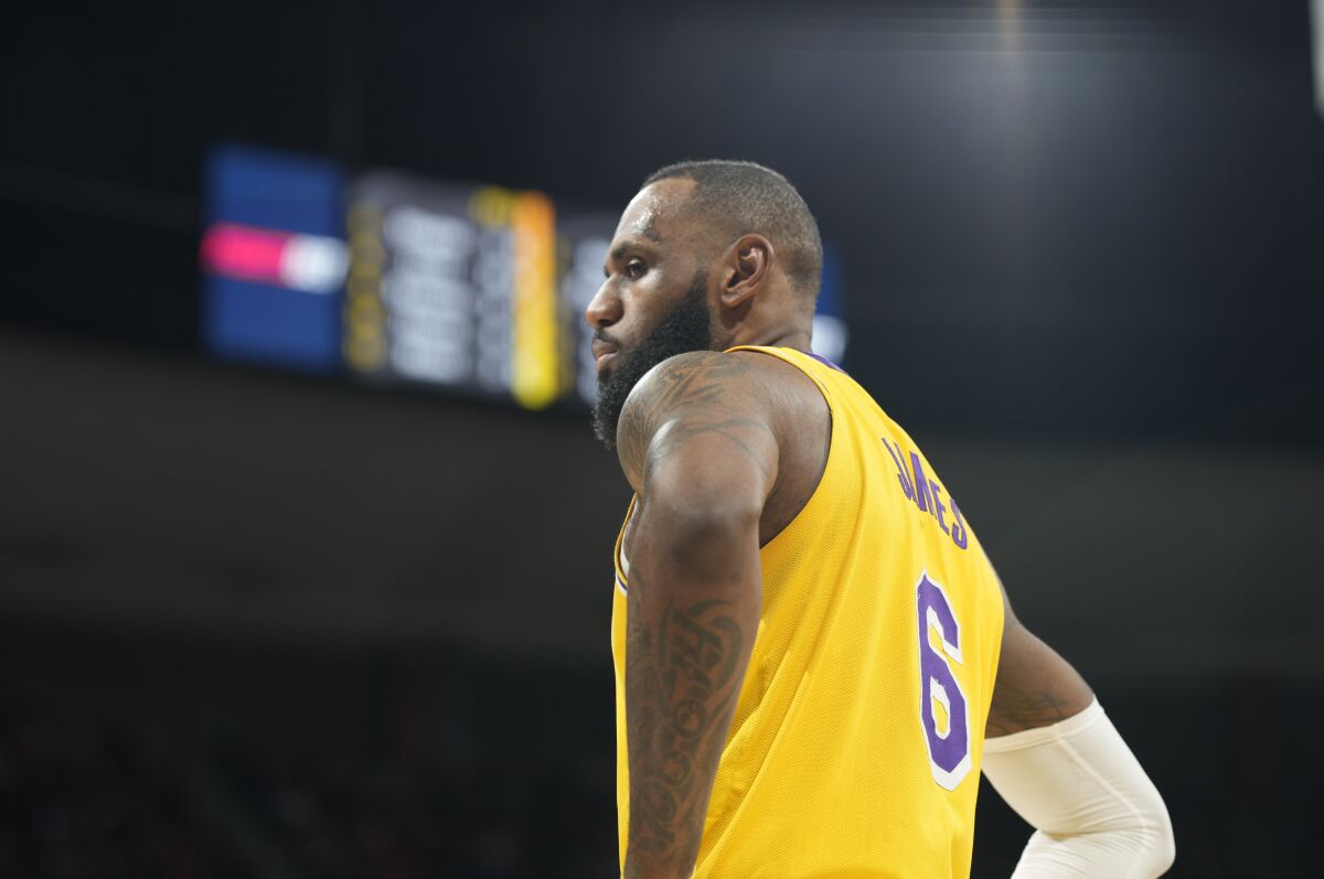 Lakers forward LeBron James casts a look at Nuggets fans