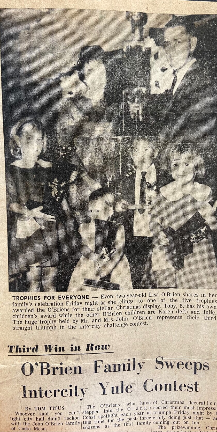 A Daily Pilot clipping shows the O'Brien family of Costa Mesa receiving an award in an Inter-City Yule Contest in 1961.