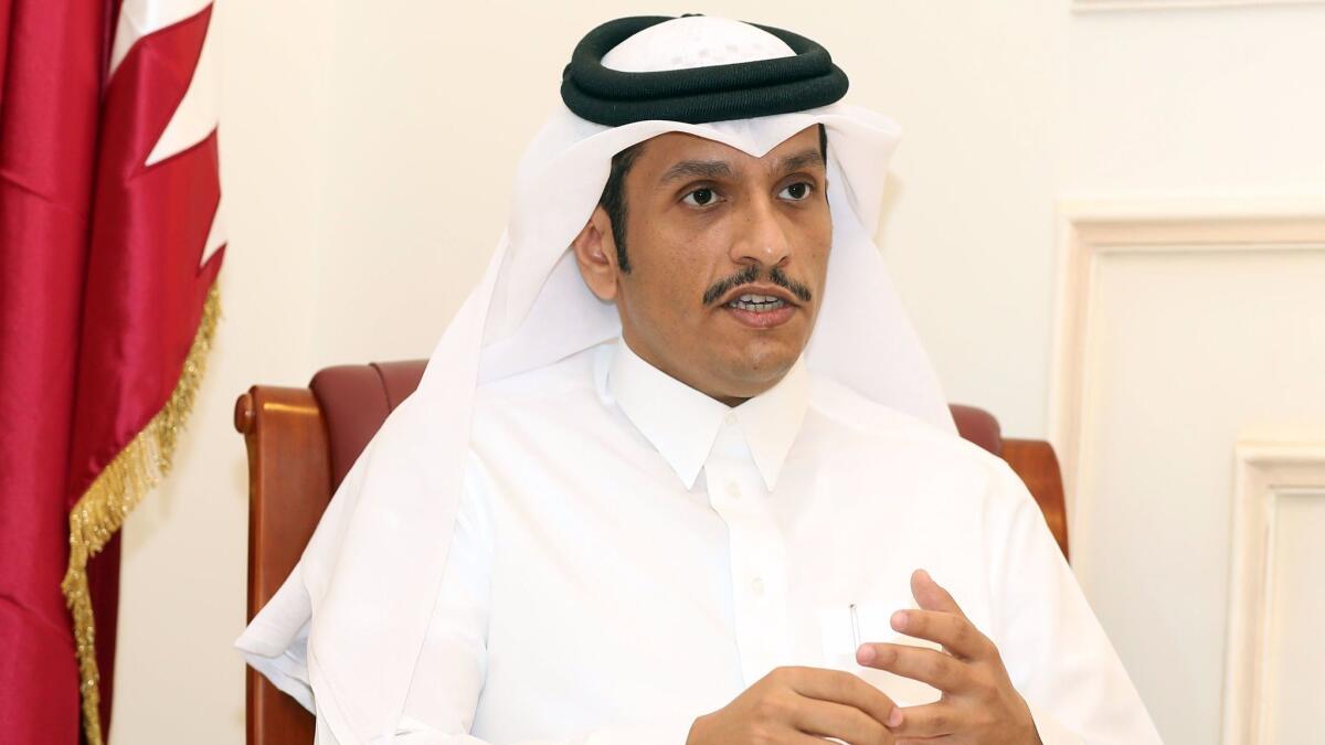 Qatari Foreign Minister Mohammed bin Abdulrahman al Thani speaks to a reporter in Doha on June 8.