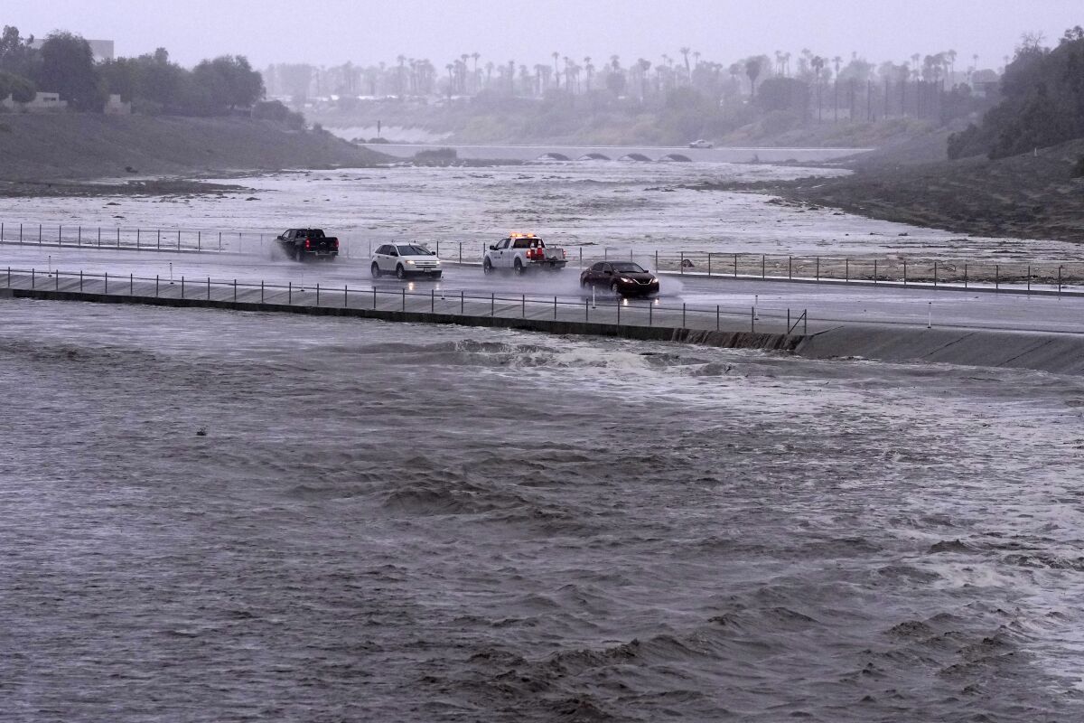 Rain from Tropical Storm Hilary lashes California and Mexico, swamping roads and trapping cars - The San Diego Union-Tribune