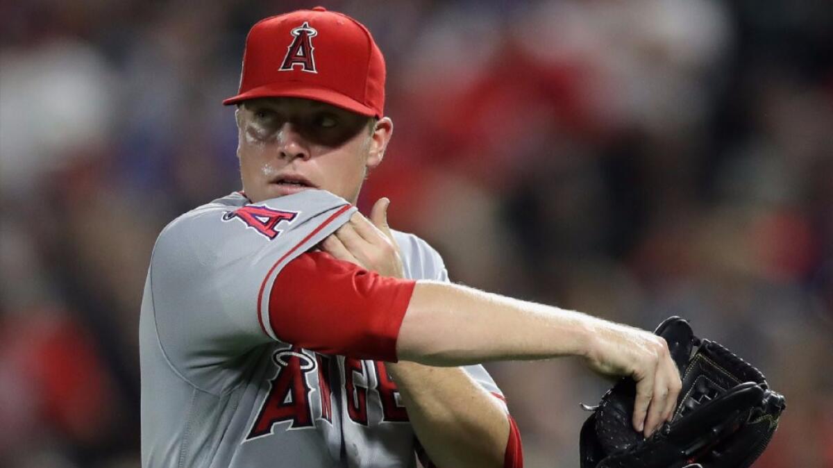 Angels pitcher Daniel Wright leaves a game against the Rangers during the fifth inning of a game on Sept. 20.