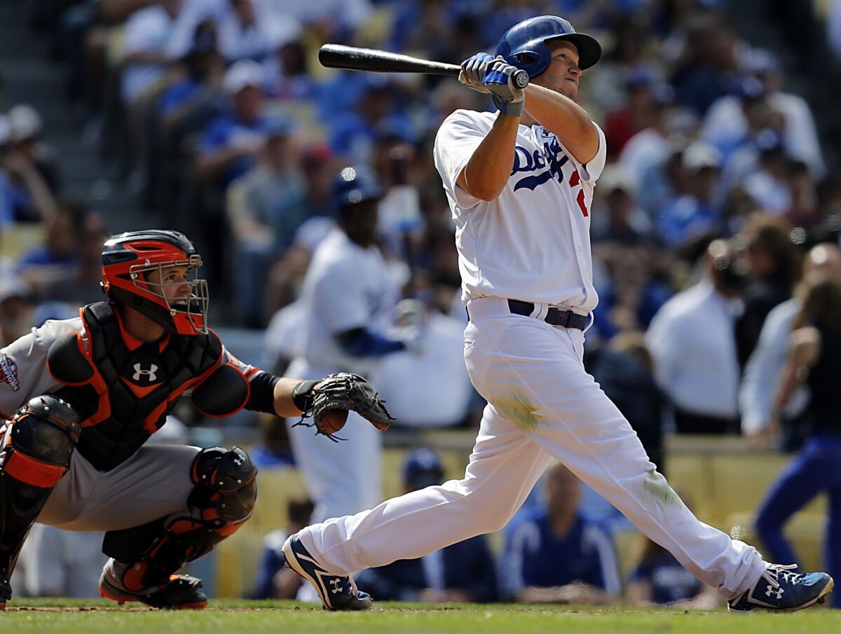 Dodgers ace pitcher Clayton Kershaw tracks the trajectory of his solo home run in the eighth inning of the season opener against the San Francisco Giants. Kershaw has hit above .200 the last two seasons.