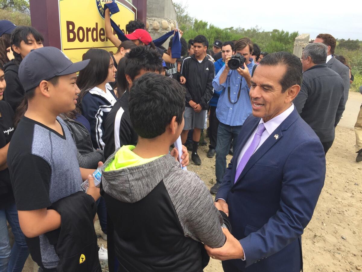 Democratic gubernatorial candidate Antonio Villaraigosa talks with students before a news conference near the U.S.-Mexico border Wednesday.