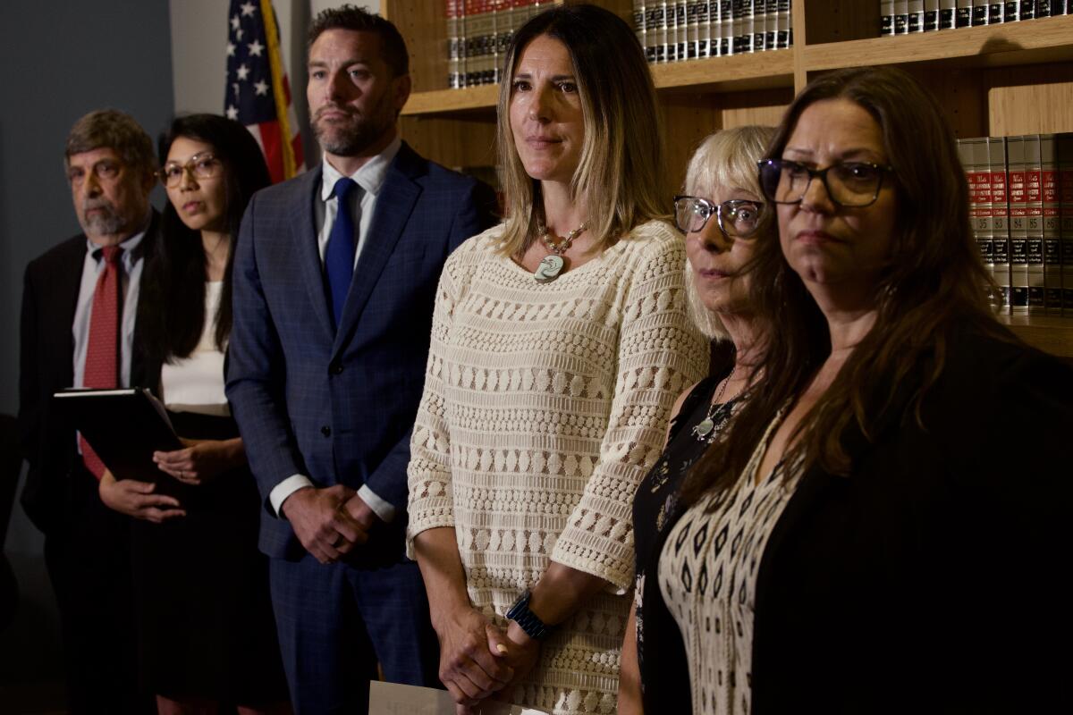 LOS ANGELES, CA - AUGUST 02: Attorneys Mark Rosenbaum, left, Amanda Mangaser Savage, Scott Humphreys and Temecula teachers Dawn Murray-Sibby, 4th. from left, Amy Eytchison and Jennee Scharf, made an announcement about filing a lawsuit challenging the imposition of curriculum censorship by the Board of Trustees of the Temecula Valley Unified School District . Press conference held at Public Counsel in Los Angeles, CA. (Irfan Khan / Los Angeles Times)