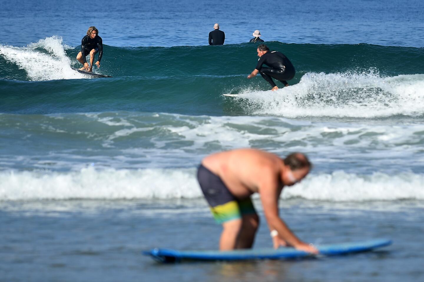 Surfers in Newport Beach