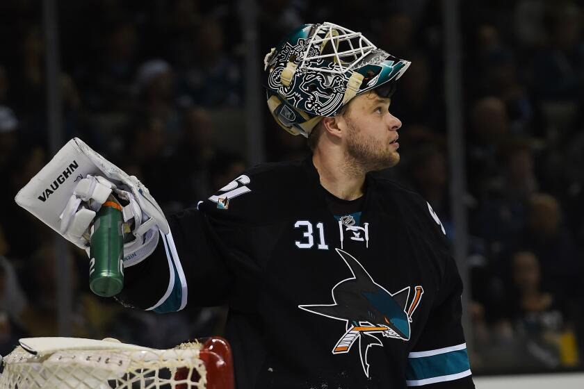 San Jose goalie Antti Niemi looks up at the scoreboard after giving up a goal to the Kings on Saturday.