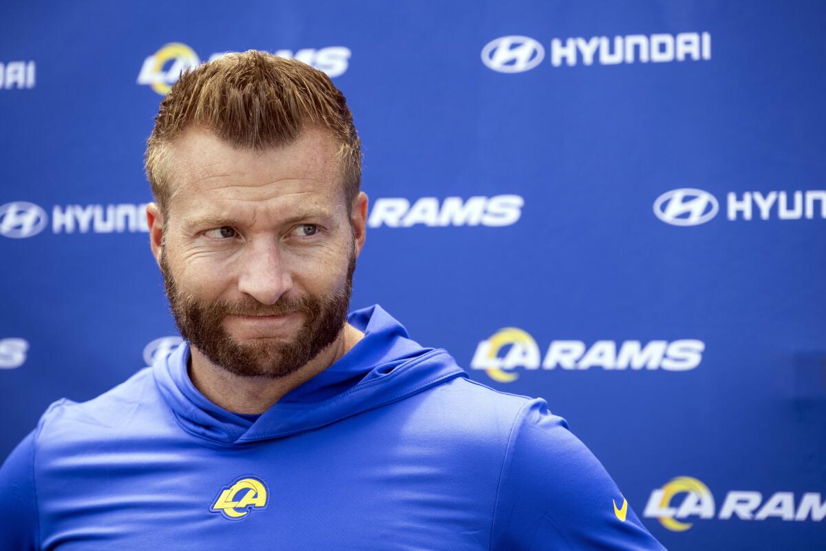 Rams coach Sean McVay listens to questions from members of the media.