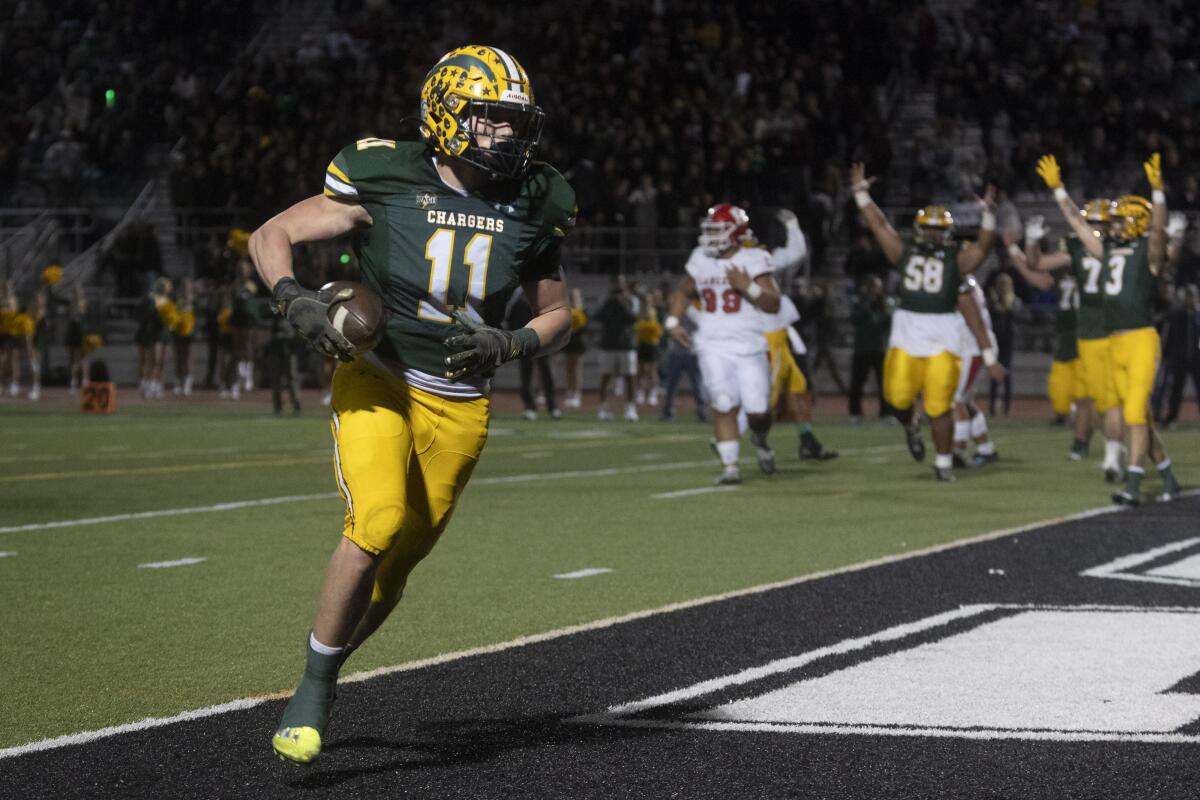 Edison's Dom Lopez scores a touchdown against Orange Lutheran during the CIF Division 1 playoffs on Friday.