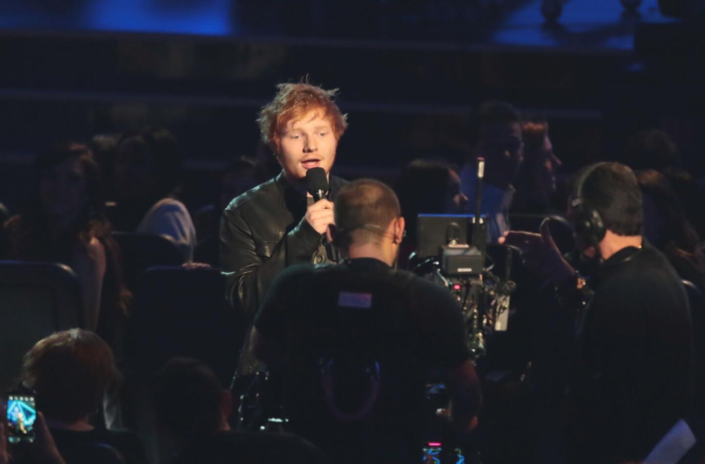 Ed Sheeran, a nominee for Best New Artist, represents the nominees for Pop Duo Group.