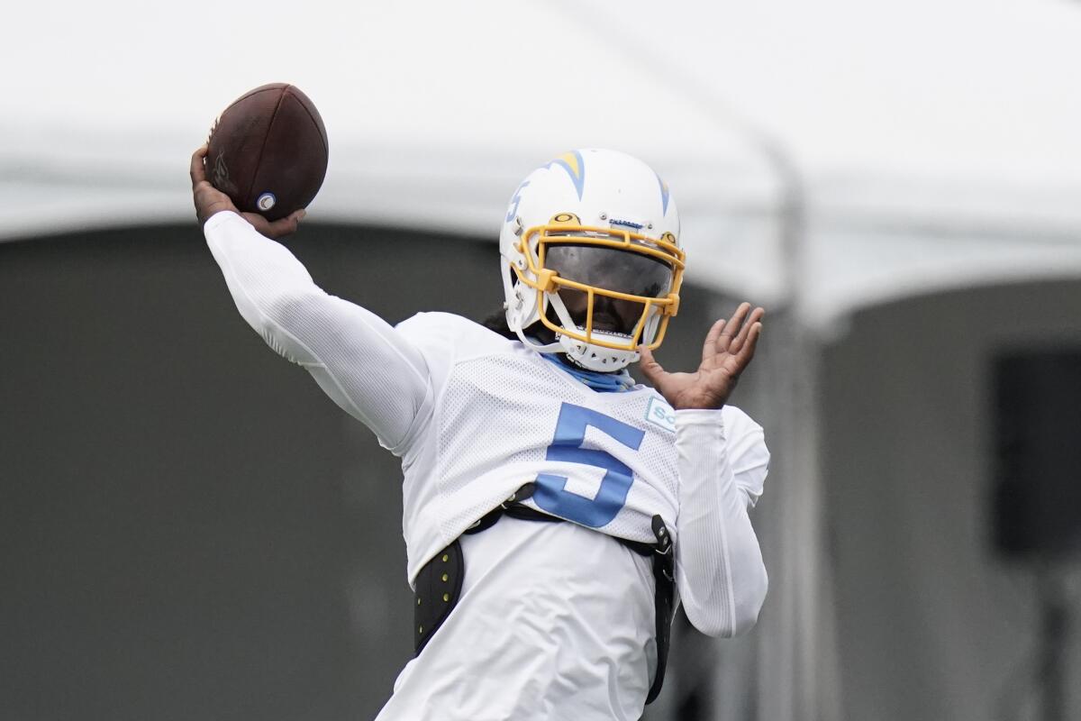 Chargers quarterback Tyrod Taylor throws a pass during training camp in Costa Mesa.