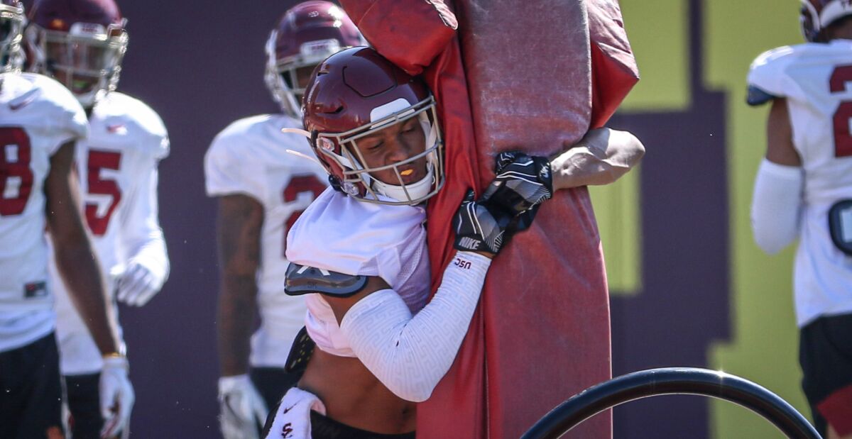 USC freshman cornerback Chris Steele tackles a sled during a practice at USC's Howard Jones Field.