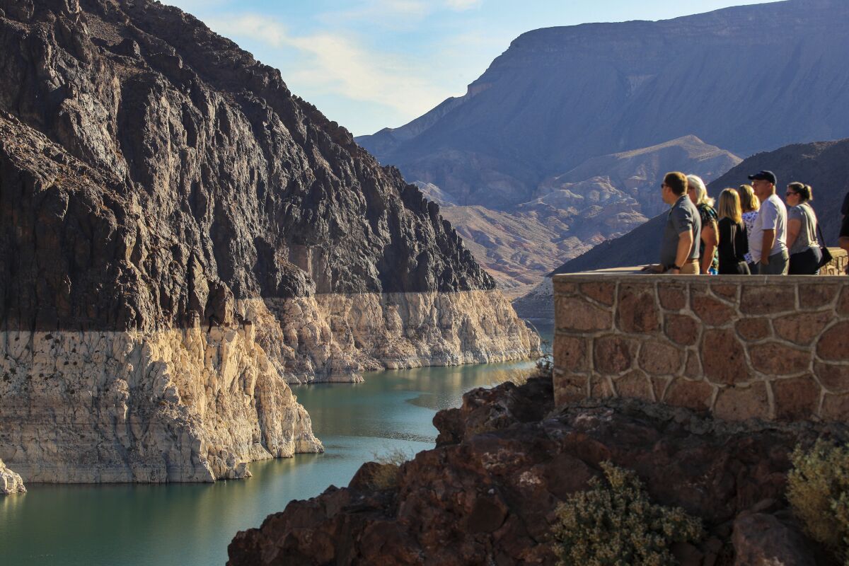 Visitors view the 'bathtub ring' left by the falling surface of Lake Mead.