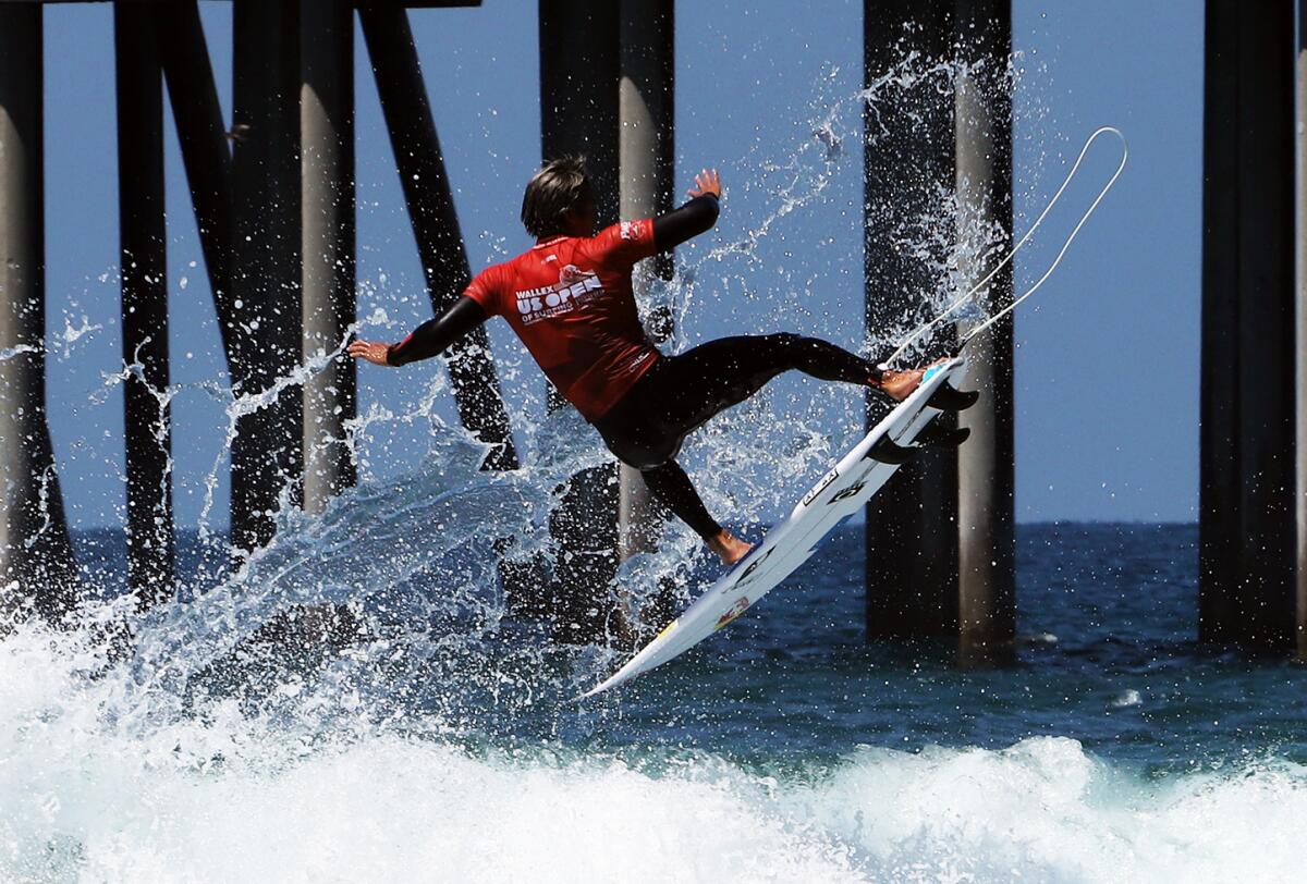 Kanoa Igarashi of Huntington Beach gets serious air during the round of 16 at the U.S. Open of Surfing on Friday.