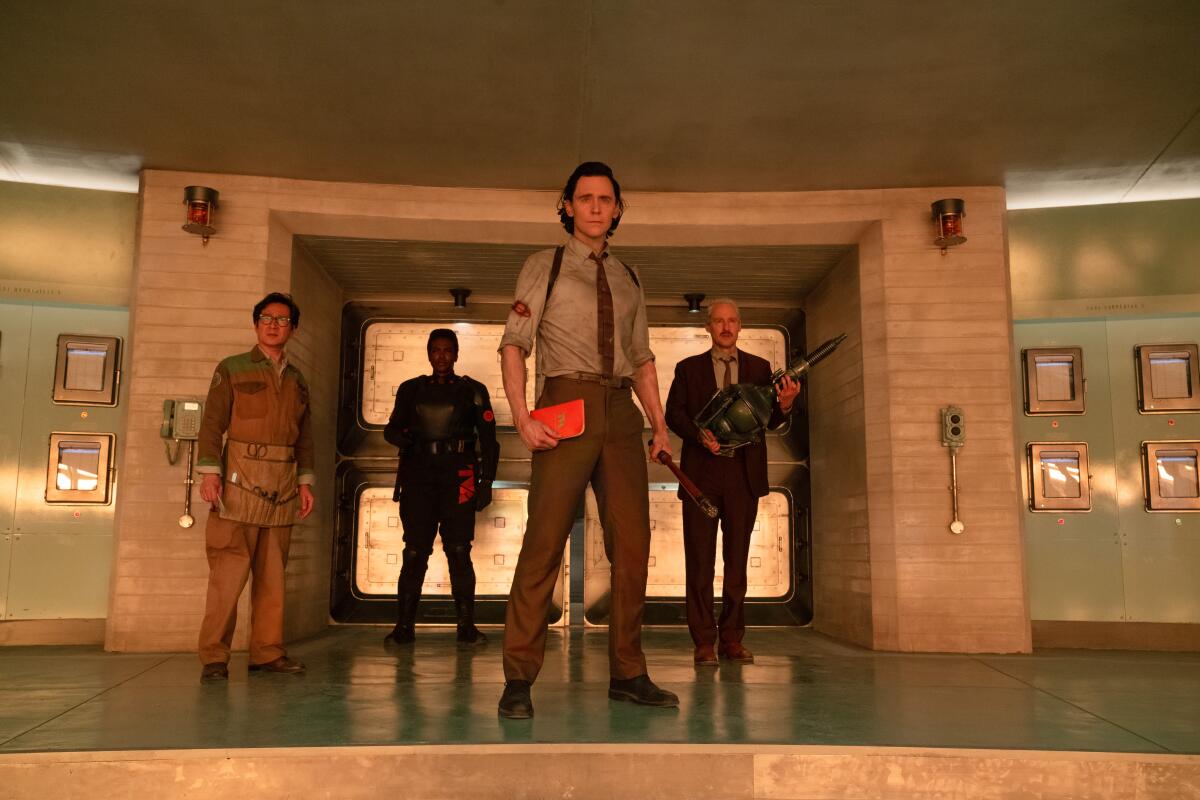 Ke Huy Quan, Wunmi Mosaku, Tom Hiddleston and Owen Wilson stand in an entryway in "Loki" Season 2.