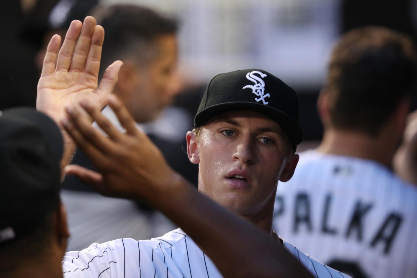 White Sox starting pitcher Michael Kopech gets a high-five in the dugout after throwing against the Red Sox in the first inning at Guaranteed Rate Field on Aug. 31, 2018.