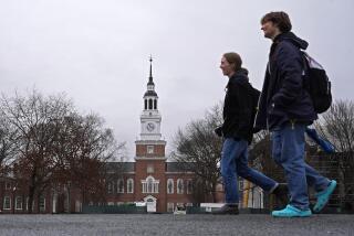 FILE - Students cross the campus of Dartmouth College, March 5, 2024, in Hanover, N.H. While tax pros say it's great for college students to start filing their own forms, parents and students should double-check everything carefully before anyone pushes the "submit" button. (AP Photo/Robert F. Bukaty, File)