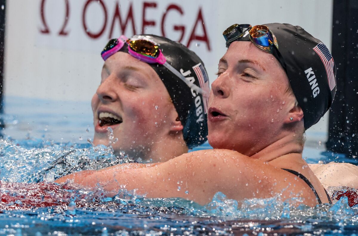U.S. swimmer Lydia Jacoby celebrates with teammate Lilly King after winning the gold medal.