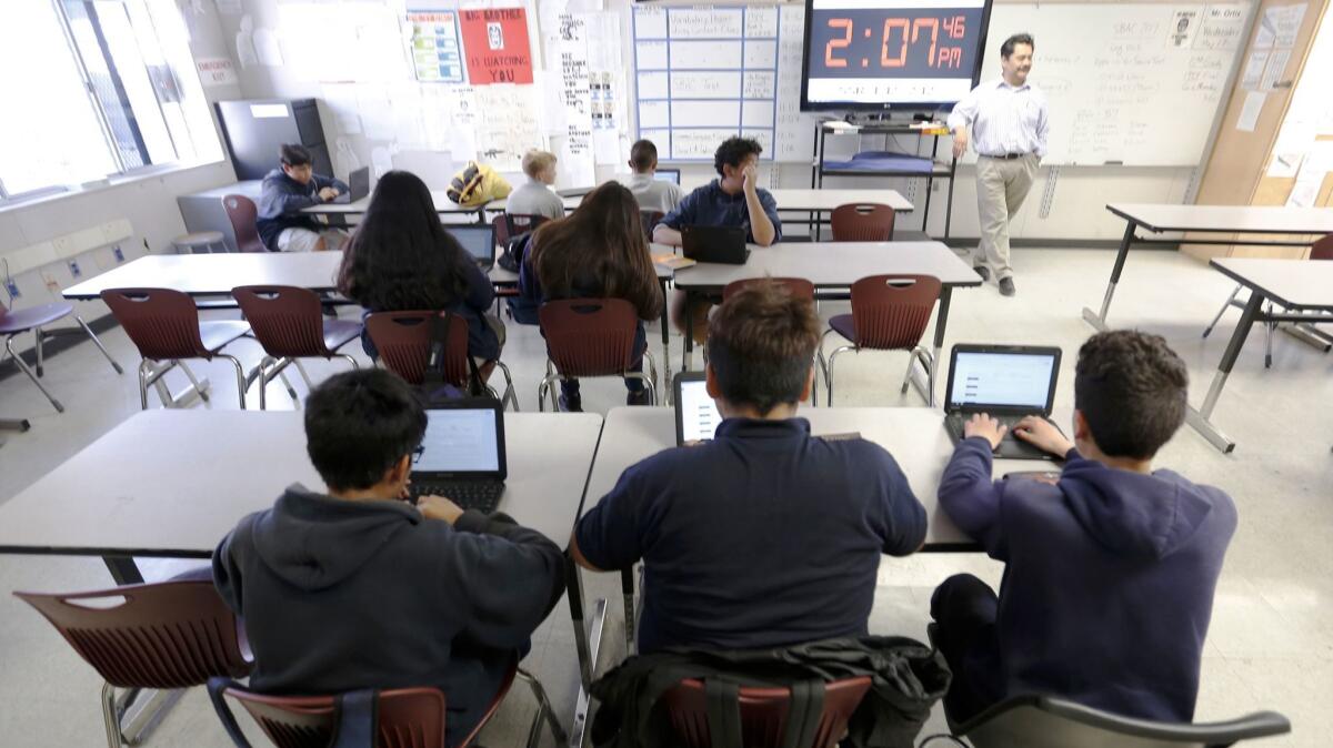 Students in the classroom of eighth-grade teacher Ron Ortiz at Magnolia Science Academy 4.