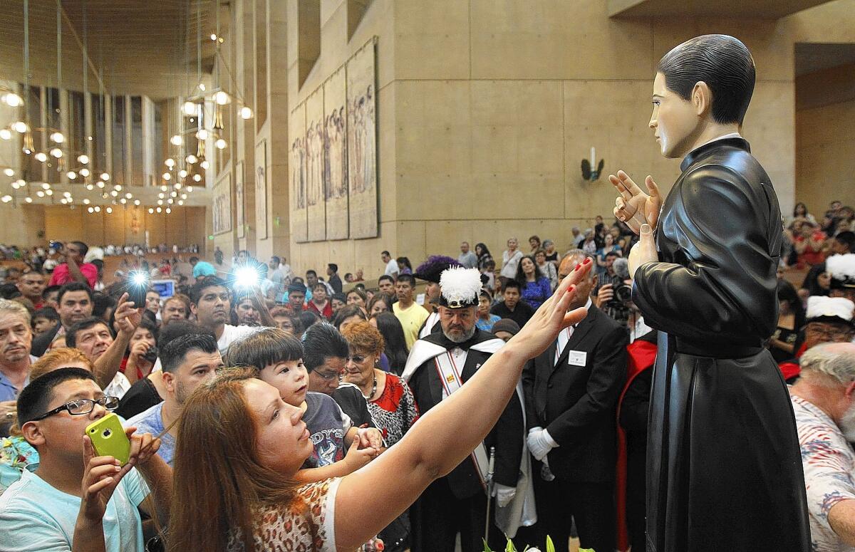 Worshippers line up to see the relic of Santo Toribio, the saint of immigrants, at the Cathedral of Our Lady of Angels in downtown Los Angeles after an annual celebration for immigrants on Sunday.