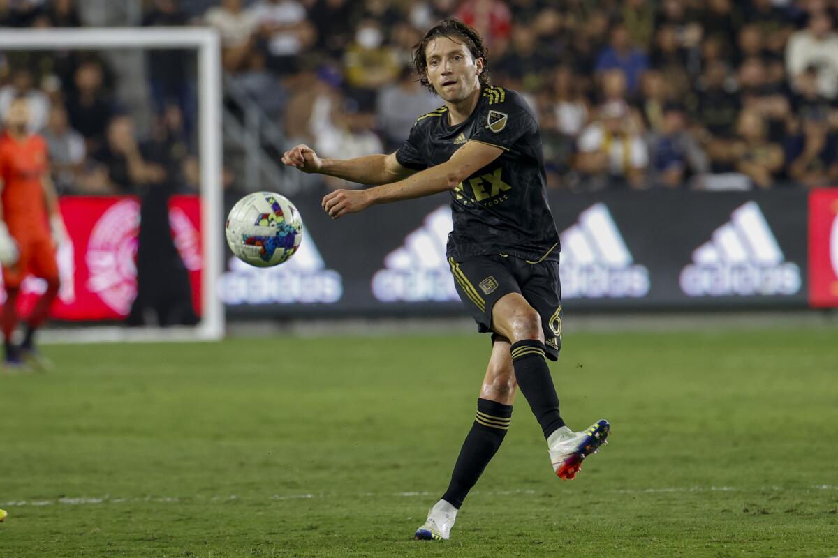 LAFC midfielder Ilie Sánchez passes the ball against the Galaxy.