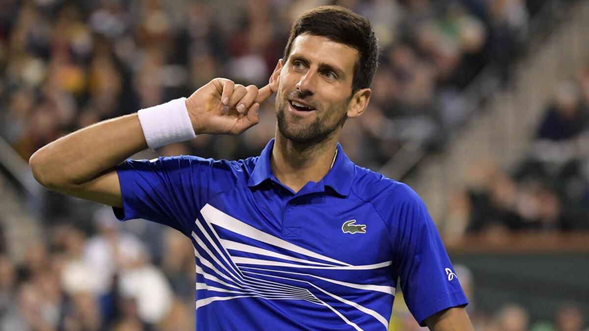 Novak Djokovic reacts to the crowd while playing against Bjorn Fratangelo at the BNP Paribas Open.