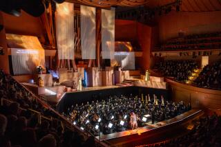 Los Angeles, CA - January 18: Simon O'neill is Loge during a staged performance of Wagner's opera, "Das Rheingold," with Gustavo Dudamel leading the Los Angeles Philharmonic with sets by Frank Gehry at Walt Disney Concert Hall in Los Angeles Thursday, Jan. 18, 2024. (Allen J. Schaben / Los Angeles Times)