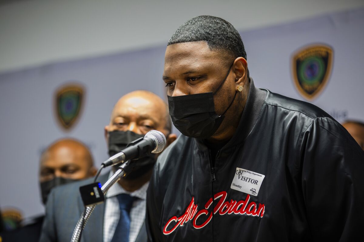 Larry Grant, uncle of 9-year-old Ashanti Grant, speaks during a news conference at the Houston Police Department headquarters Monday, Feb. 14, 2022, in Houston. Grant explained that she was watching cartoons in the back of the family car when she got shot during a road rage incident last week. (Marie D. De Jesús/Houston Chronicle via AP)