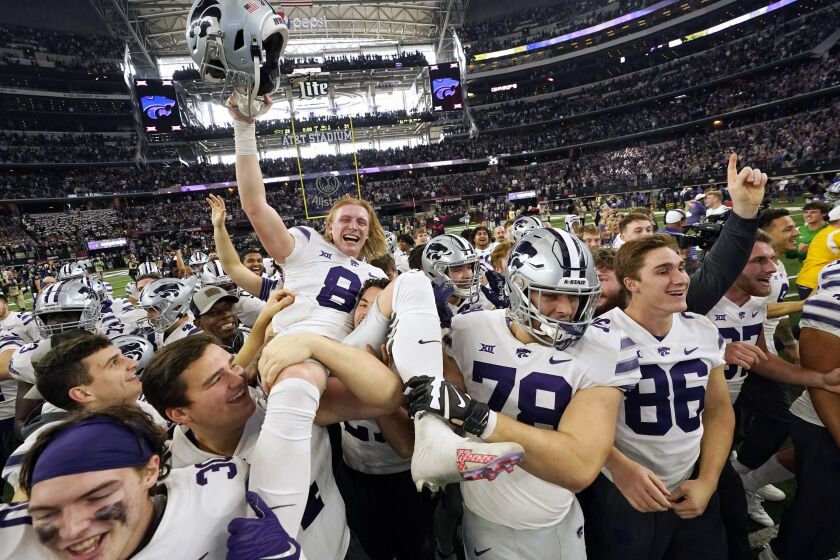 Kansas State's Ty Zentner (8) is lifted up by his teammates after hitting the game winning field goal in overtime of the Big 12 Conference championship NCAA college football game against TCU, Saturday, Dec. 3, 2022, in Arlington, Texas. (AP Photo/LM Otero)