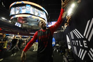 Houston, TX - March 31: San Diego State's Darrion Trammell high fives fans after the Aztecs practiced for their Final Four game in the NCAA Tournament on Friday, March 31, 2023 in Houston, TX. (K.C. Alfred / The San Diego Union-Tribune)