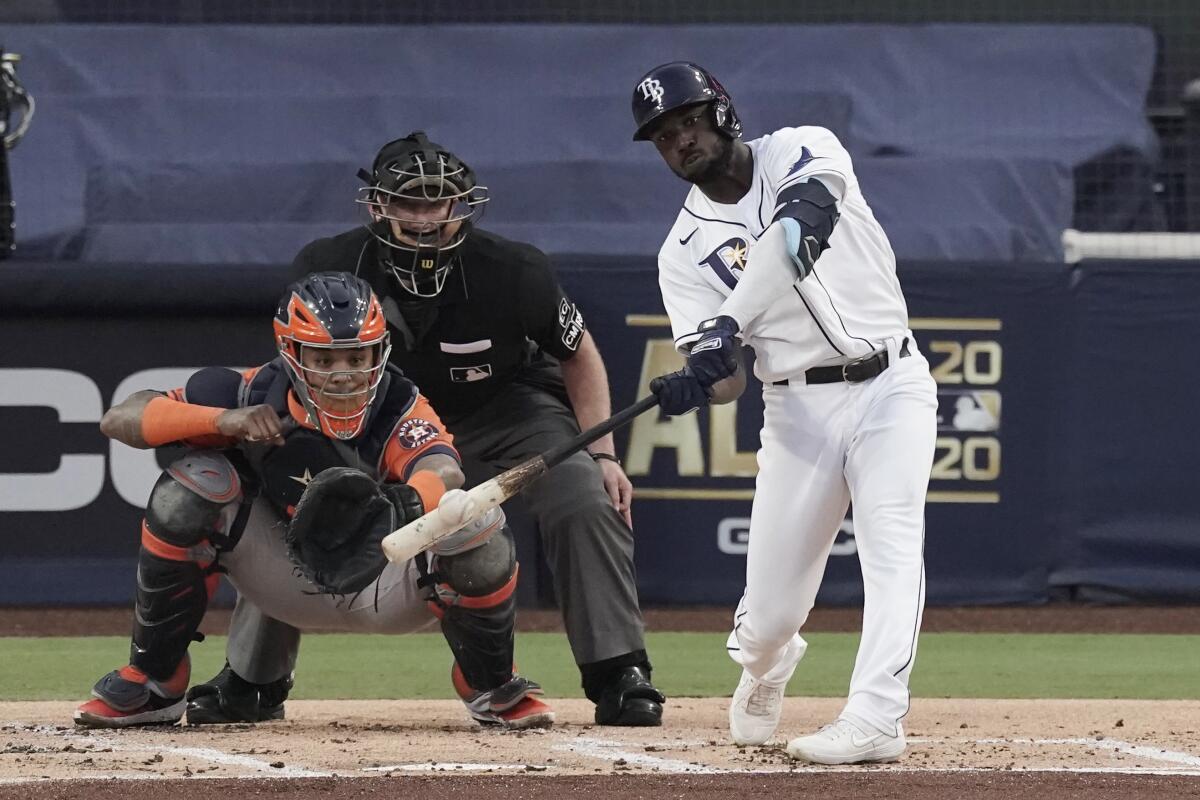 Randy Arozarena hits a two-run home run during Game 7 of the ALCS.