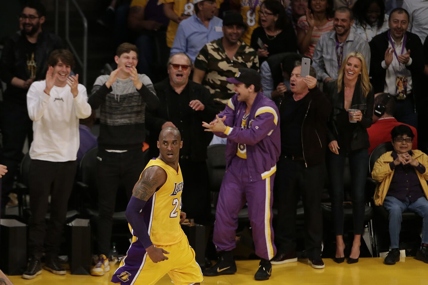 Front row fans, including Jack Nicholson cheer Kobe Bryant after he hits a shot during first half action against the Jazz at Staples Center.